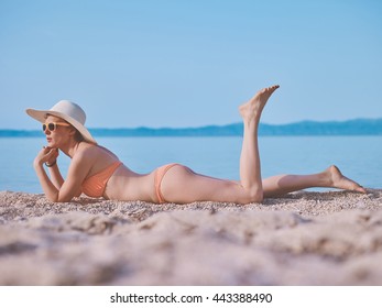 Beautiful Woman Bikini Sunbathing Seaside Stock Photo