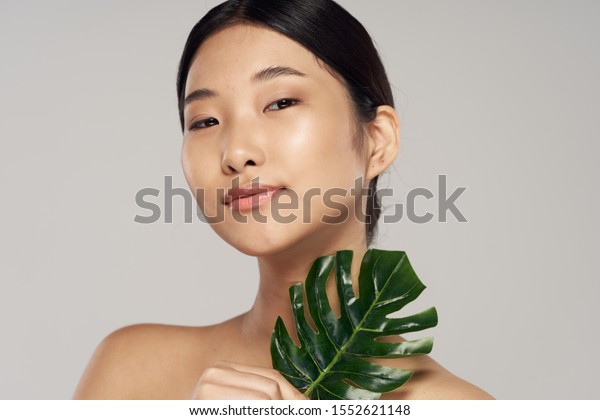 Beautiful Woman Naked Shoulders Palm Leaf Stock Photo 1552621148