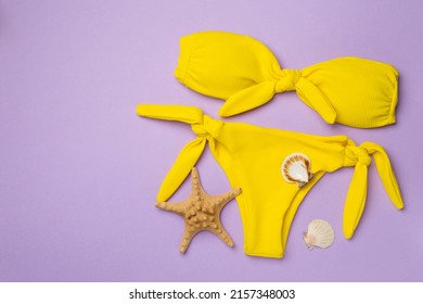 Beautiful Yellow Bikini On Color Background Stock Photo 2157348003