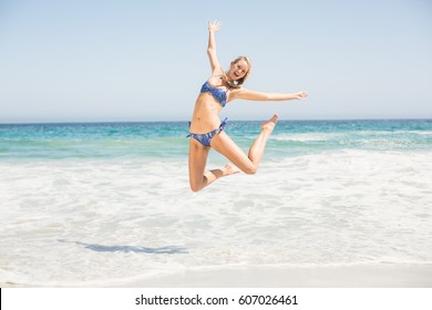 Carefree Woman Bikini Jumping On Beach Stock Photo Shutterstock