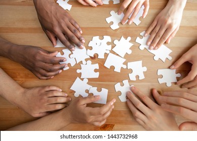 Close Multiracial People Team Assembling Puzzle Stock Photo Edit Now