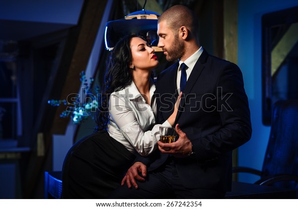 Couple Indoors Sensual Brunette Seduces Handsome Stock Photo