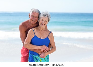 Cute Mature Couple Embracing On Beach Stock Photo Edit Now