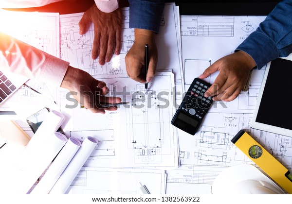 Engineers Pointing Building On Blueprint Using Stock Photo 1382563922