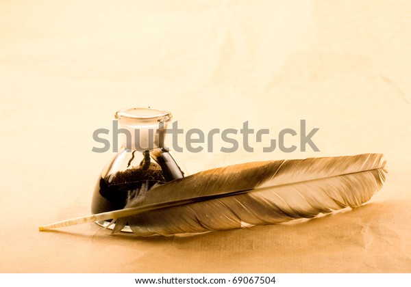 Feather Ink Bottle Isolated On Paper Stock Photo Edit Now 69067504