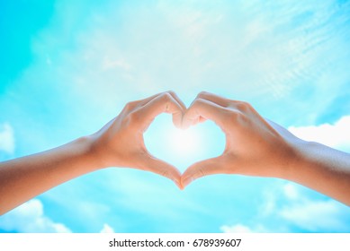 Female Hands Form Heart Against Blue Stock Photo 678939607 Shutterstock