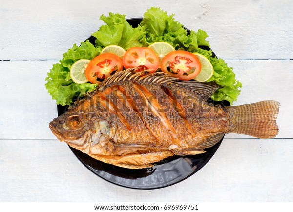 Fried Fish Vegetable On Black Dish Stock Photo Edit Now