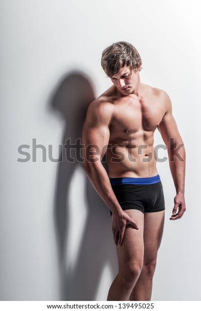 Gorgeous Caucasian Male Model Leaning Against Stock Photo 139495025