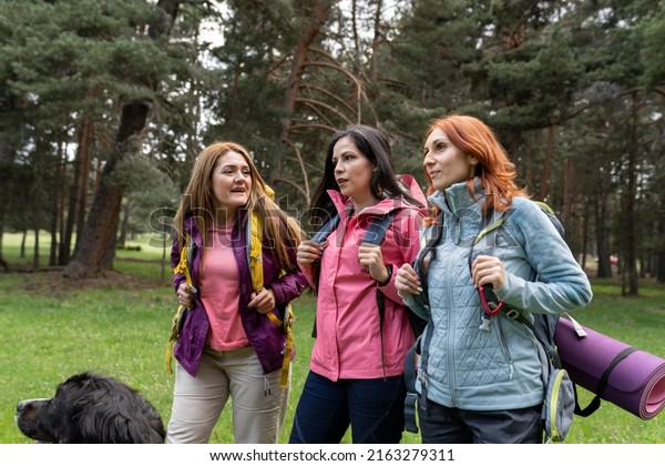 Group Three Mature Women Hiking Smiling Stock Photo