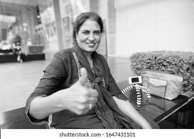 Happy Mature Beautiful Indian Woman Exploring Stock Photo