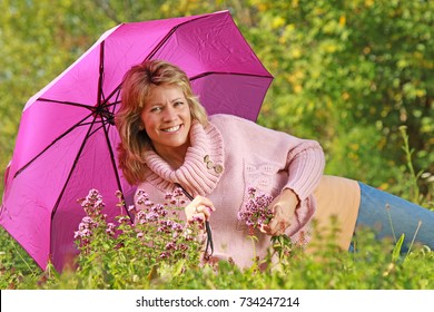 Happy Mature Woman Umbrella Lying Meadow Stock Photo