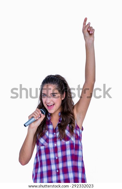 Happy Pretty Brunette Singing On Microphone Stock Photo