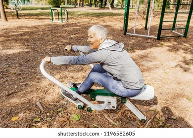 Healthy Mature Woman Practicing Outdoor Gym Stock Photo 1196582605