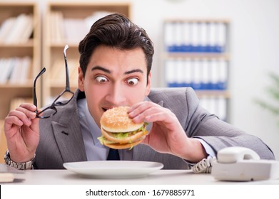 Hungry Funny Businessman Eating Junk Food Stock Photo Edit Now 608398841