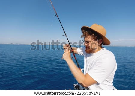 Fisherman Removes Hook From Fish Stock Photos And Images Avopix