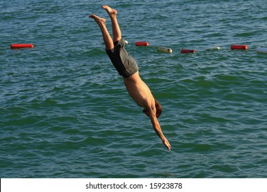 Man Jumping Into Sea Stock Photo Shutterstock