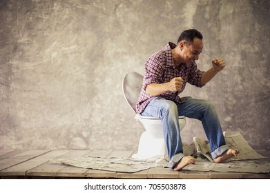 Man Sitting On Toilet Stock Photo 705503878 Shutterstock