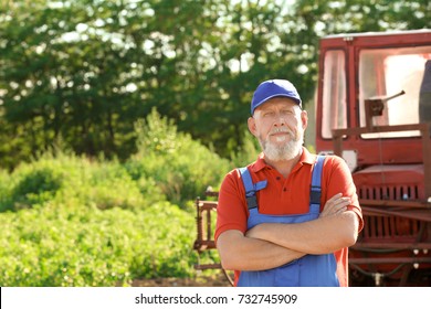 Mature Farmer Standing Near Tractor Stock Photo Shutterstock