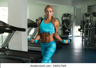 Mature Fitness Woman Working Out Biceps Stock Photo