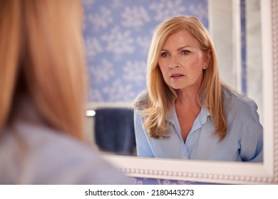 Menopausal Mature Woman Looking Skin Mirror Stock Photo