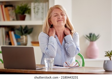 Menopausal Mature Woman Suffering Neck Pain Stock Photo