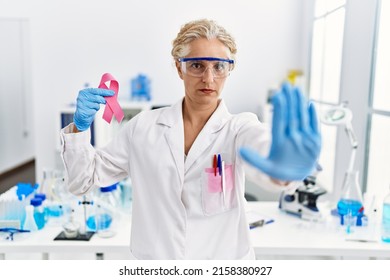 Middle Age Blonde Woman Working Laboratory Stock Photo