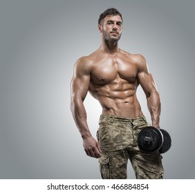 Muscular Athlete Bodybuilder Man Camouflage Pants Stock Photo