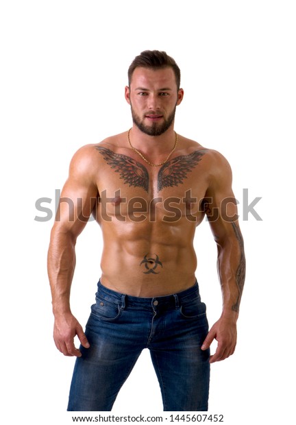 Muscular Male Bodybuilder Standing And Looking At Camera Shirtless