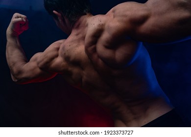 Muscular Man Showing Muscles Isolated On Stock Photo