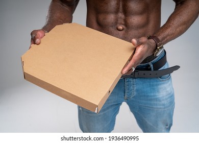 Muscular Sexy Courier Bringing Tasty Pizza Stock Photo