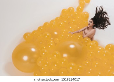 Nude Woman Between Many Yellow Balloons Stock Photo 1519224017