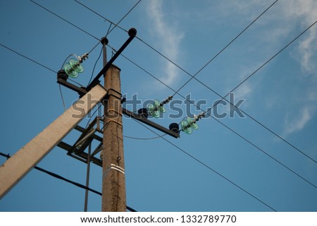 Old Power Line Support on the blue sky background
