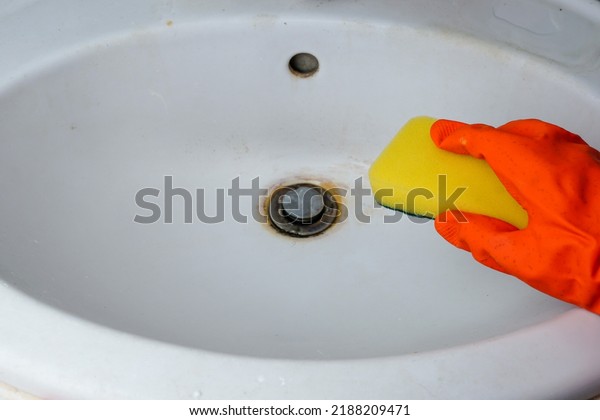 Person Hand Holding Yellow Sponge Cleans Stock Photo