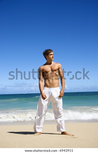 Physically Fit Shirtless Man Standing On Stock Photo Edit Now 6943951