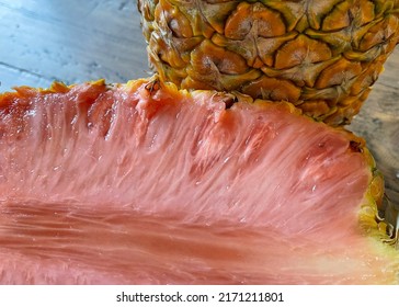 Pink Fleshed Pineapple Showing Inside Outside Stock Photo