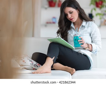 Pleased Cute Brunette Sitting On Couch Stock Photo 421862344 Shutterstock