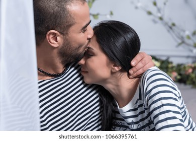 Smiling Muslim Couple Hugging Touching