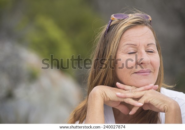 Portrait Happy Attractive Mature Woman Sitting Stock Photo