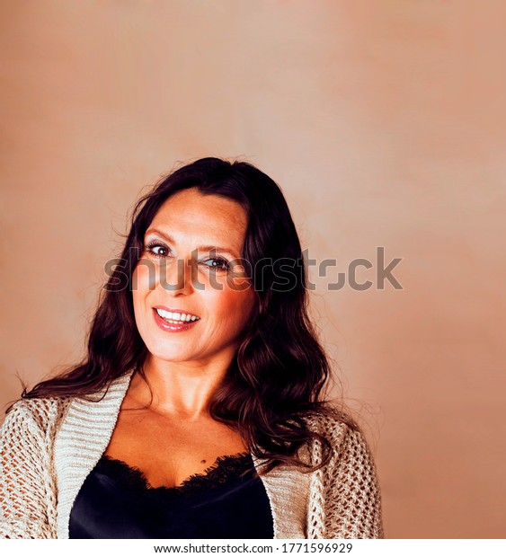 Pretty Brunette Confident Mature Woman Posing Stock Photo