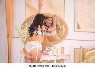 Pretty Slim Brunette White Lace Lingerie Stock Photo