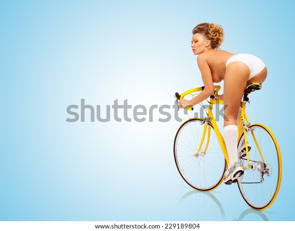 Retro Photo Of A Nude Sexy Pin Up Girl In White Erotic Panties Riding A Yellow Racing Bicycle On