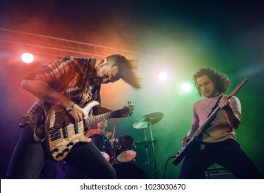 Rock Band Performs On Stage Guitarist Stock Photo Shutterstock