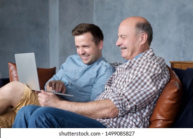 Senior Hispanic Father Mature Son Looking Stock Photo