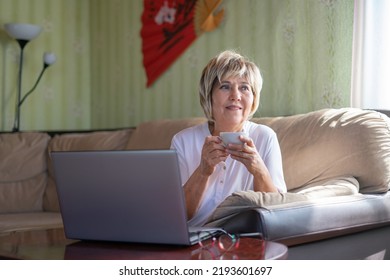 Serious Mature Woman Wearing Glasses Working Stock Photo