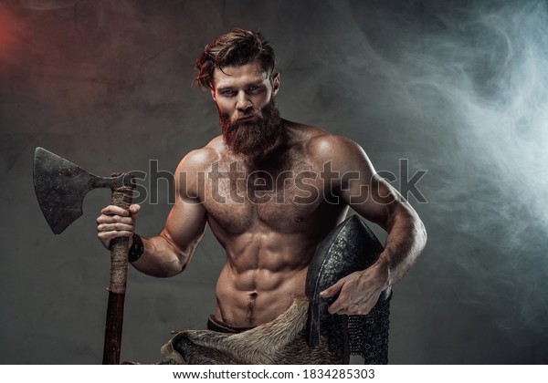 Стоковая фотография 1834285303 Serious Muscular Viking Beard Naked