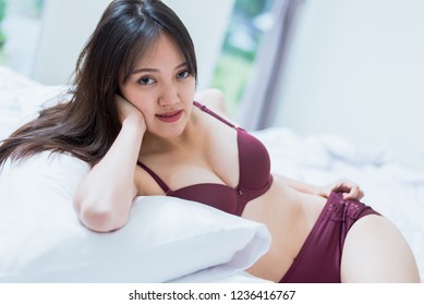 Sexy Asian Woman Purple Lingerie Sitting Shutterstock