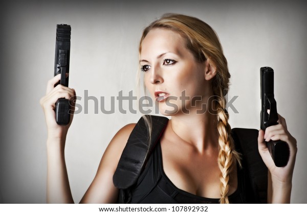 Sexy Beautiful Dangerous Woman Shooting Two Stock Photo