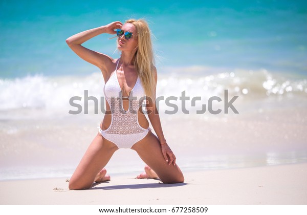 Sexy Blond Kneeling On The Tropical Paradise Beach