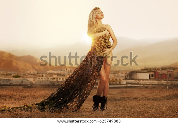 Sexy Blonde Nude Covered With Camouflage Net At The Sunset Horizontal View