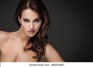 Sexy Brunette Woman Posing On Dark